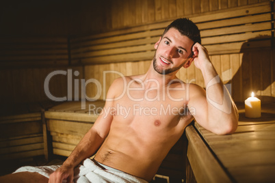 Man sitting inside a sauna