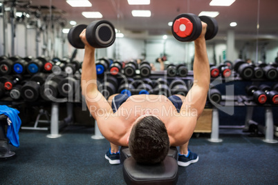 Man using weights in his workout