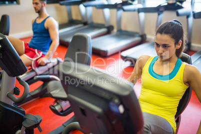 Woman using exercise machine