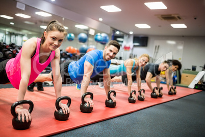 Fit people working out in fitness class