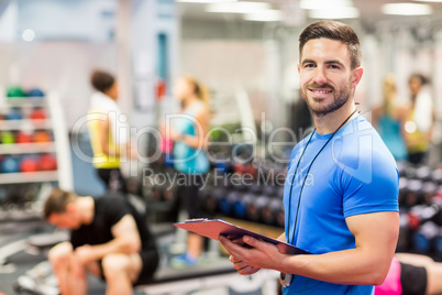 Handsome trainer smiling at camera