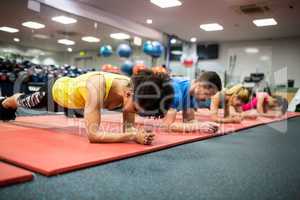 Fit people working out in fitness class