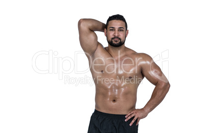 Muscular man flexing for camera