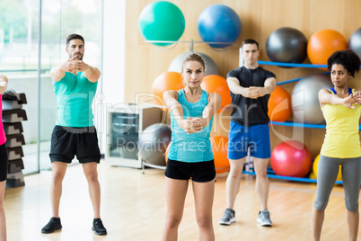 Fitness class exercising in the studio