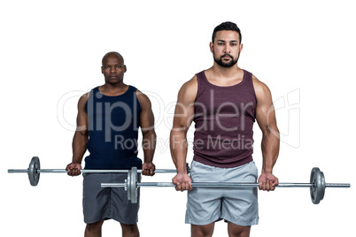 Man lifting barbell with trainer