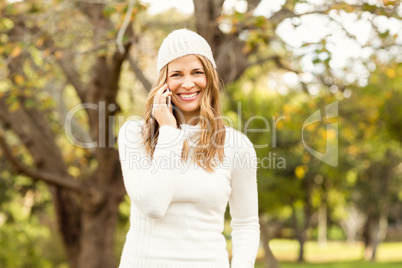 Smiling pretty woman having a phone call