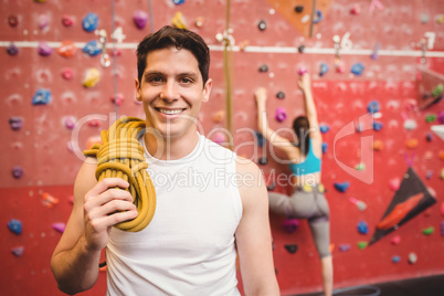 Fit man at the rock climbing wall