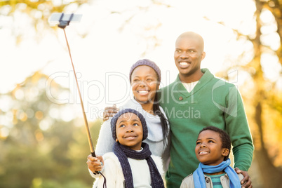 Young smiling family taking selfies