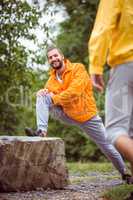 Man stretching on a hike