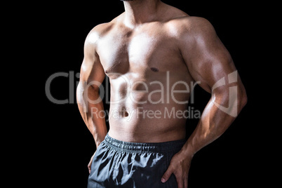 Mid section of a bodybuilder man