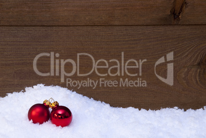 Wooden Christmas Background On Snow, Red Balls As Decoration