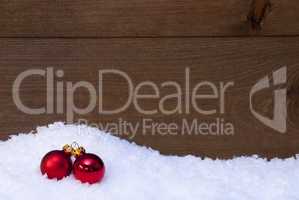 Wooden Christmas Background On Snow, Red Balls As Decoration