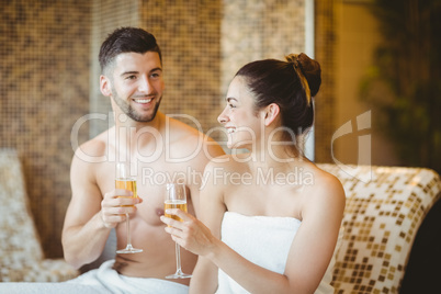 Romantic couple together with champagne glasses