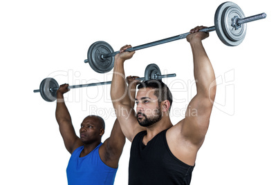 Man lifting barbell with trainer