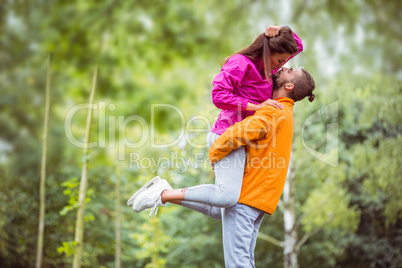 Happy couple hugging on hike