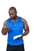 Fit trainer checking his stopwatch