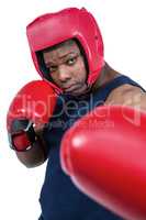 Fit man boxing with gloves