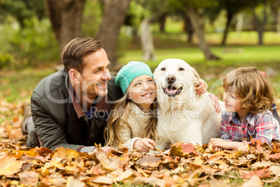 Smiling young family with dog