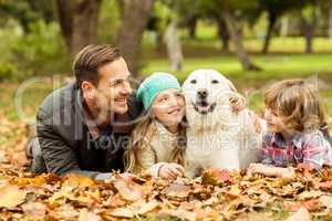 Smiling young family with dog