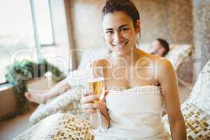 Smiling woman holding a glass of champagne