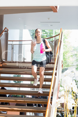 Woman walking down stairs