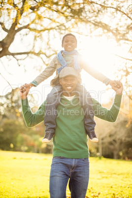 Portrait of a father with his son in piggyback