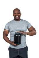 Fit man scooping protein powder