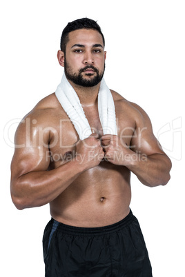 Muscular man with towel on shoulders