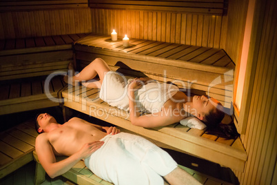 Couple relaxing in the sauna