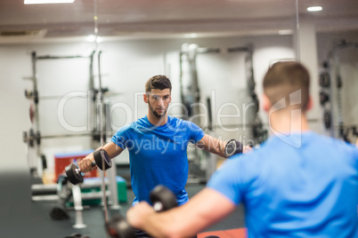 Man using weights in his workout