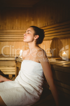 Happy woman enjoying the sauna