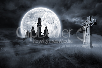 Castle and grave under full moon