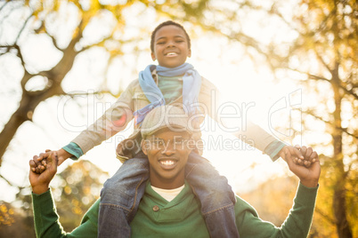 Portrait of a father with his son in piggyback