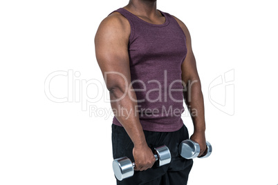 Fit man exercising with dumbbell