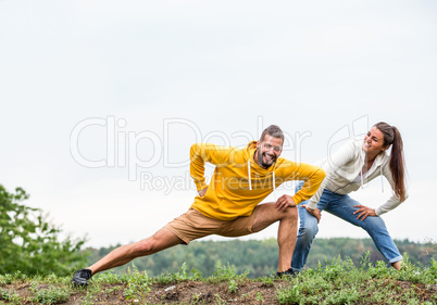 Couple stretching on a hike