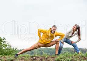 Couple stretching on a hike