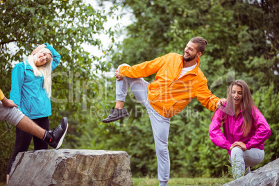 Friends stretching before a hike