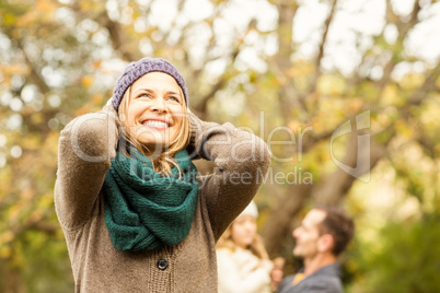 Smiling woman against her husband and her daughter