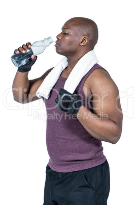 Fit man exercising with barbell