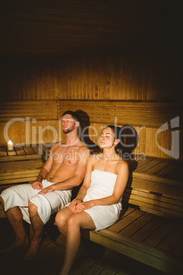 Happy couple enjoying the sauna together