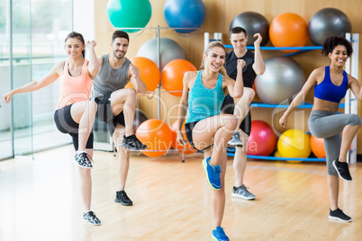 Fitness class exercising in the studio