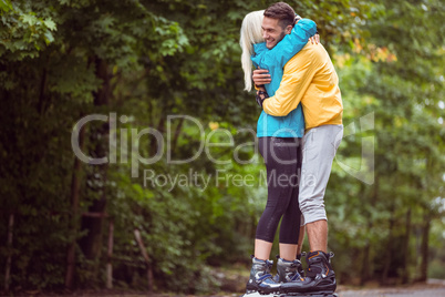 Happy couple roller blading together