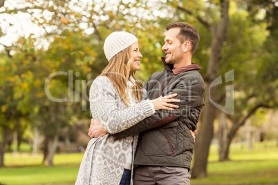 Portrait of smiling young couple embracing