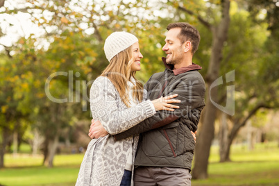 Portrait of smiling young couple embracing Portrait of smiling young couple embracing