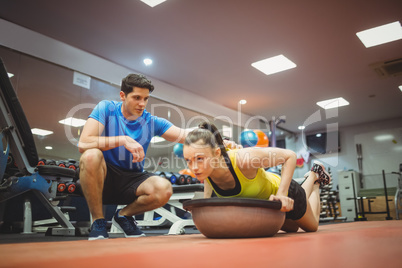 Fit woman working out with trainer Fit woman working out with trainer