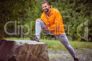 Man stretching on a hike