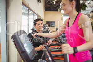 Fit woman working out with trainer