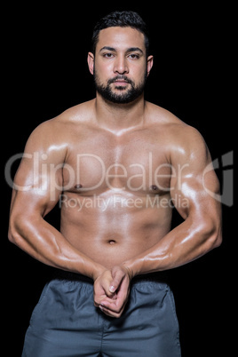 Portrait of a bodybuilder man flexing muscles