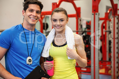 Trainer and woman discussing workout plan