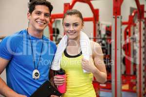 Trainer and woman discussing workout plan